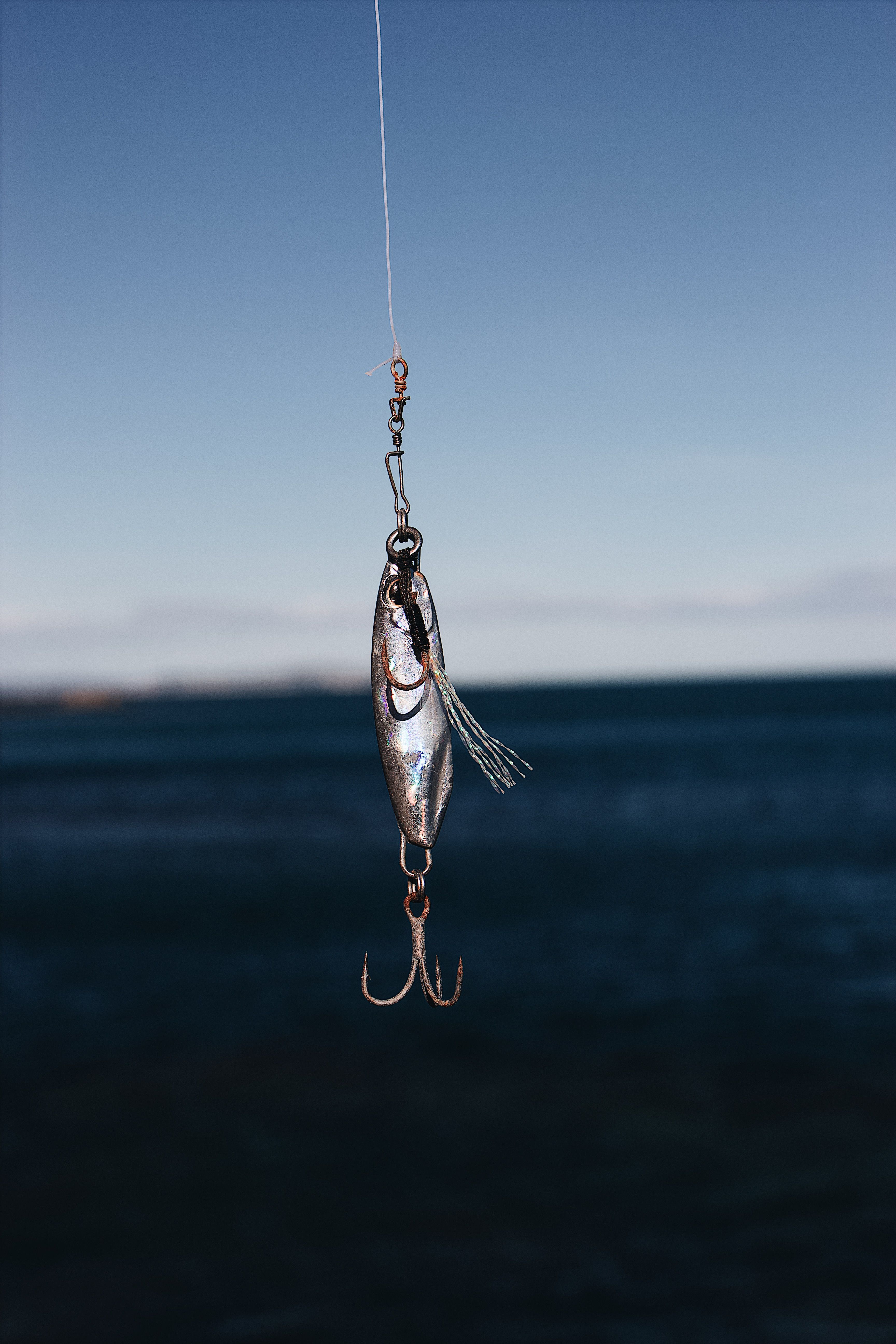 Fishing rod, reel and fly box arranged outdoors